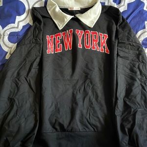 Collared crew neck New York embossed sweater